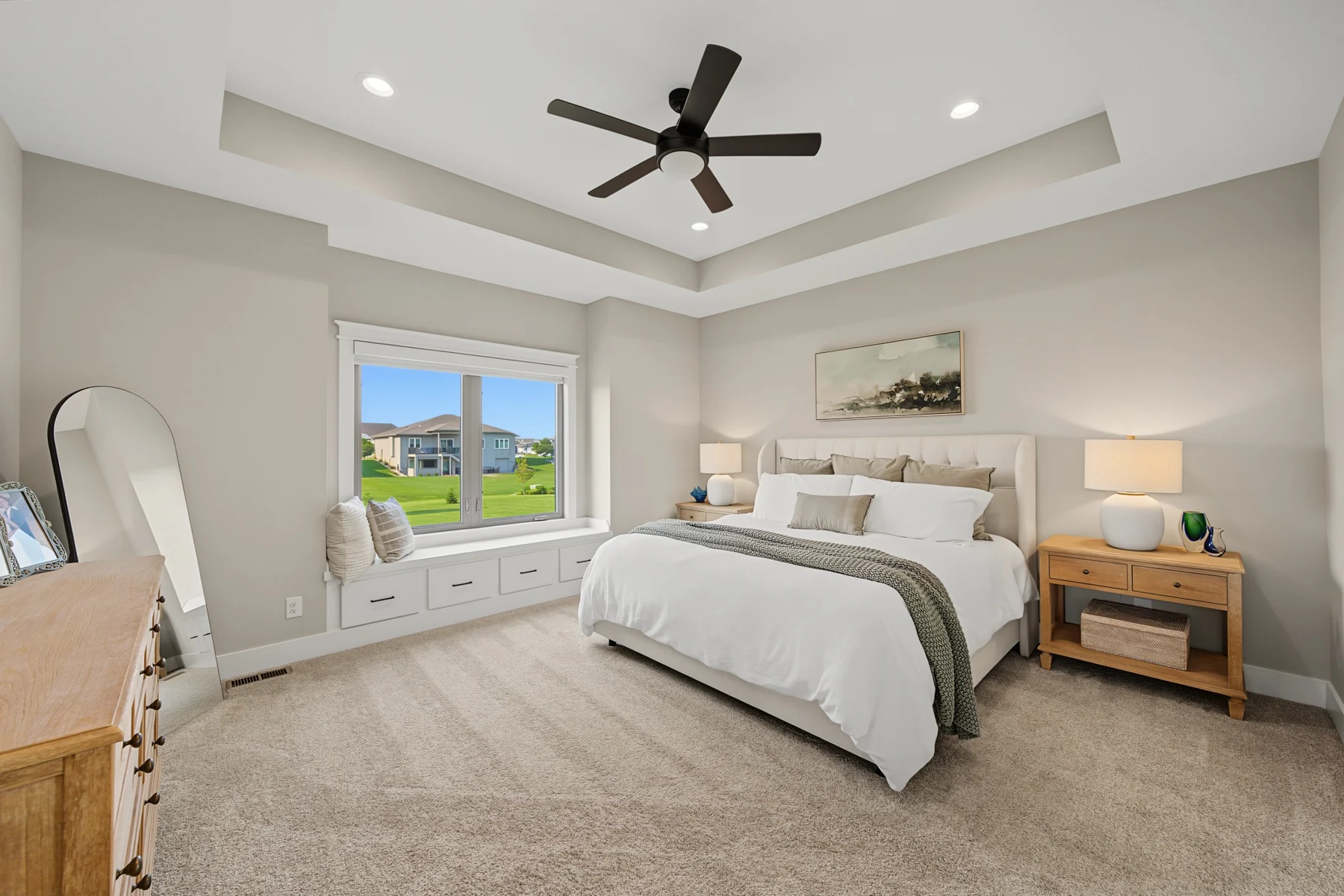 Airy bedroom with white bedding, wood nightstands, and soft neutral accents