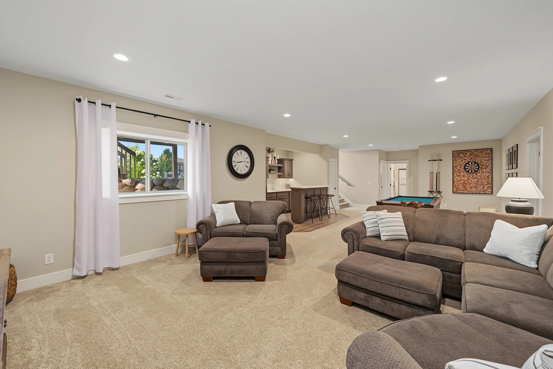 Comfortable family living space with neutral seating and a wood coffee table